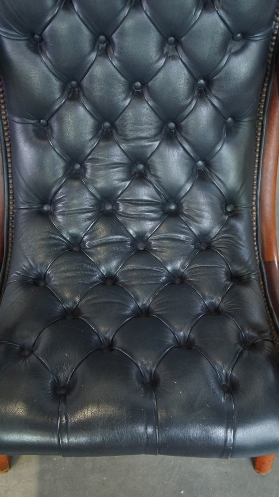 Image 1 of Donkerblauwe Chesterfield Fauteuil Gemaakt Van Rundleer En Gecombineerd Met Hout