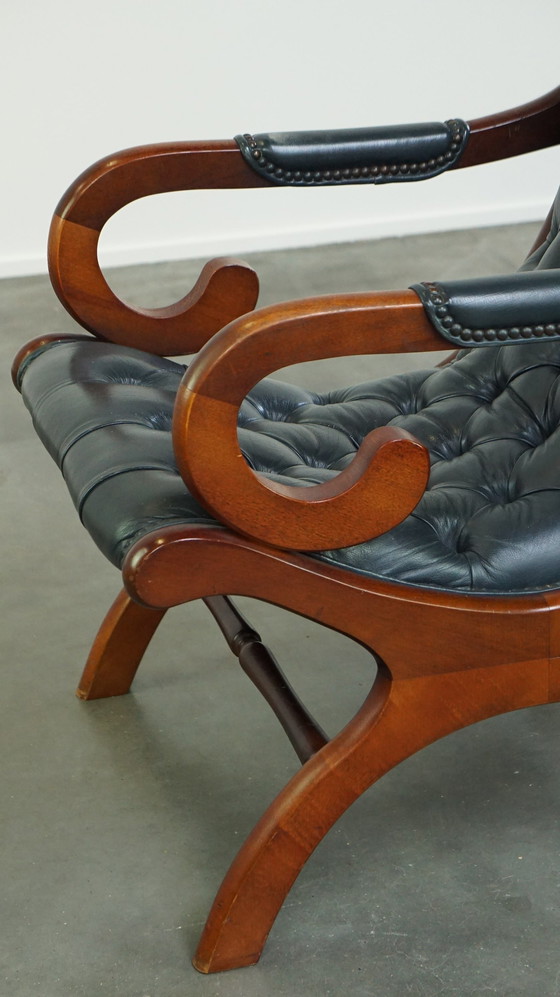 Image 1 of Donkerblauwe Chesterfield Fauteuil Gemaakt Van Rundleer En Gecombineerd Met Hout