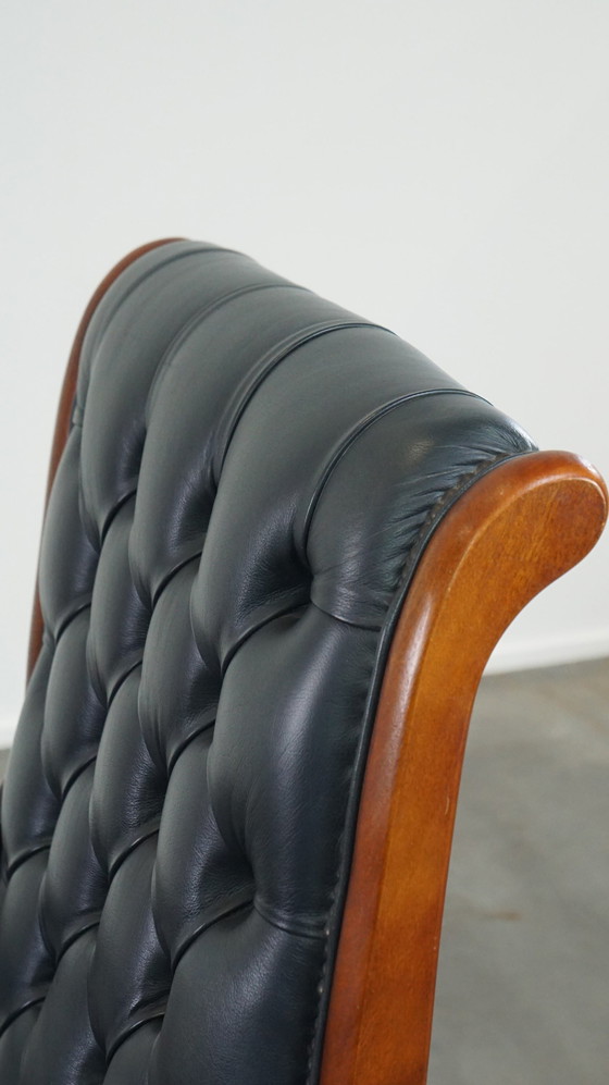 Image 1 of Donkerblauwe Chesterfield Fauteuil Gemaakt Van Rundleer En Gecombineerd Met Hout