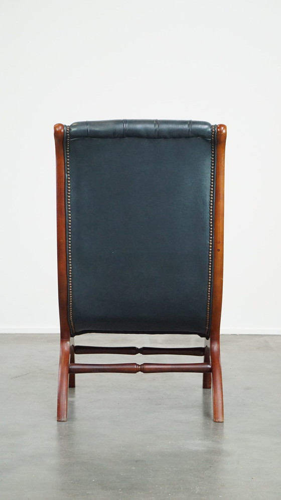 Image 1 of Donkerblauwe Chesterfield Fauteuil Gemaakt Van Rundleer En Gecombineerd Met Hout