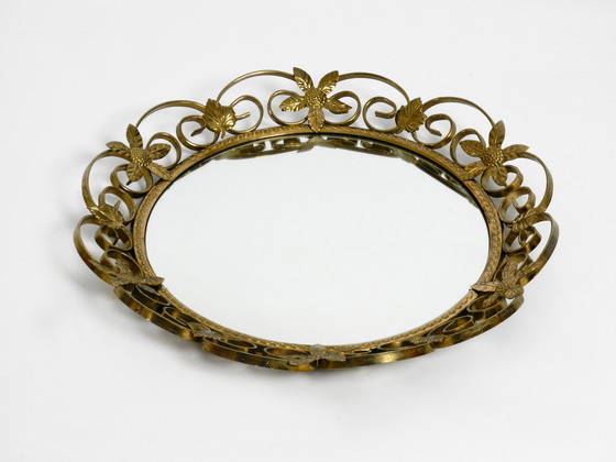 Image 1 of Prachtige mid century messing wandspiegel van hoge kwaliteit met convex gebogen spiegelglas