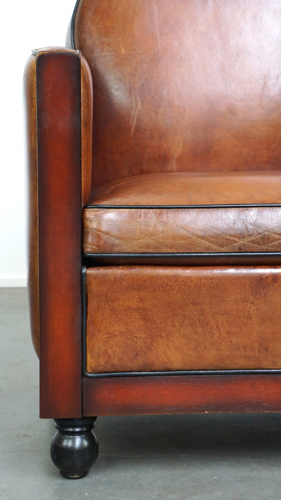 Image 1 of Schapenleren ArtDeco design fauteuil afgewerkt met hout