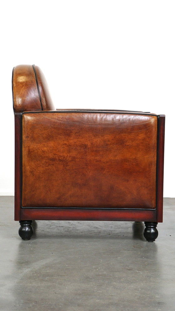 Image 1 of Schapenleren ArtDeco design fauteuil afgewerkt met hout