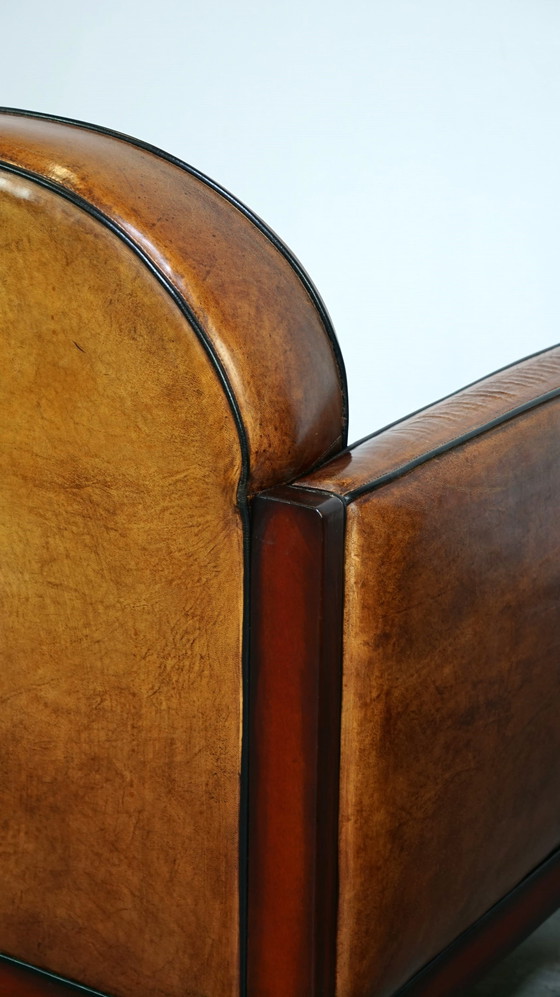 Image 1 of Schapenleren ArtDeco design fauteuil afgewerkt met hout