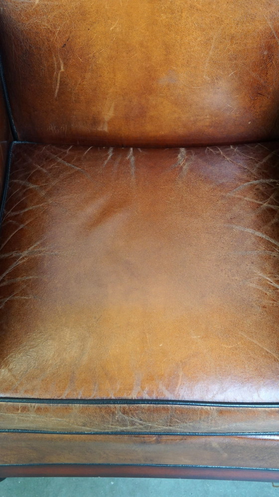 Image 1 of Schapenleren ArtDeco design fauteuil afgewerkt met hout