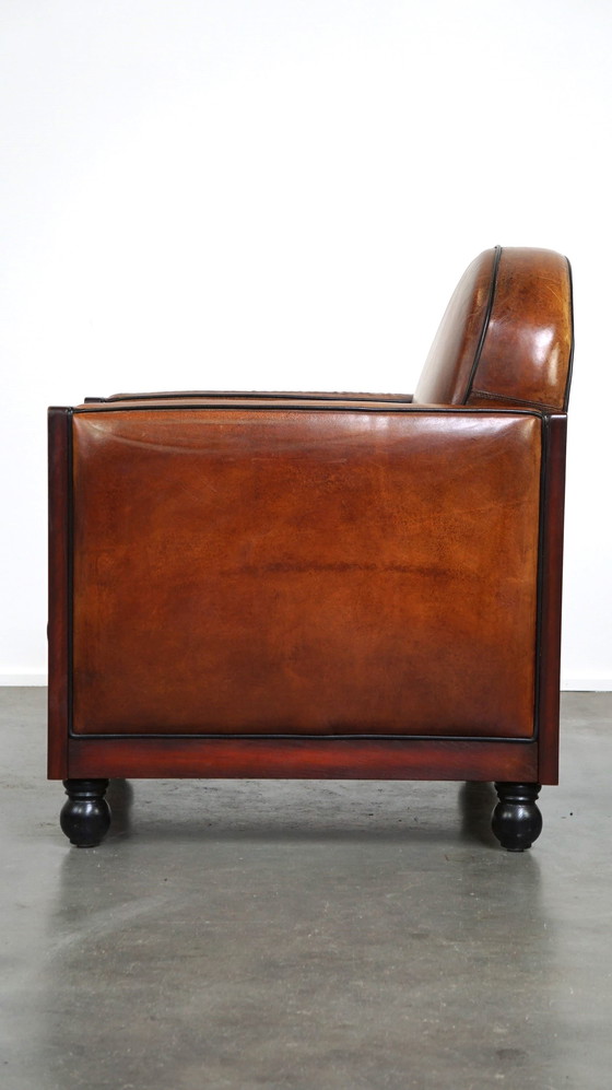 Image 1 of Schapenleren ArtDeco design fauteuil afgewerkt met hout