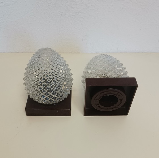 Image 1 of Twee Dennenappel Plafondlampen met Bakeliet Voet