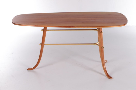 Image 1 of Vintage Salontafel met 3 poten en messing details Scandinavie.