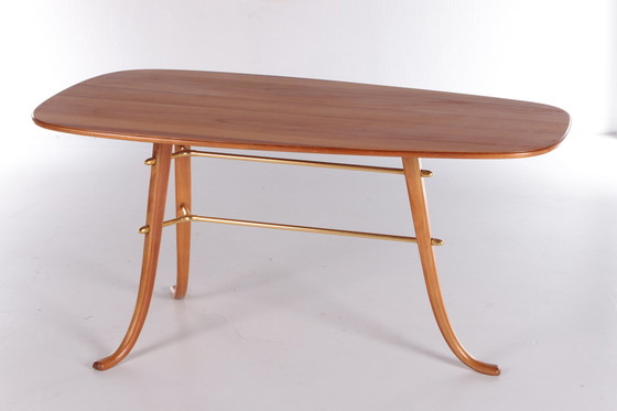 Image 1 of Vintage Salontafel met 3 poten en messing details Scandinavie.