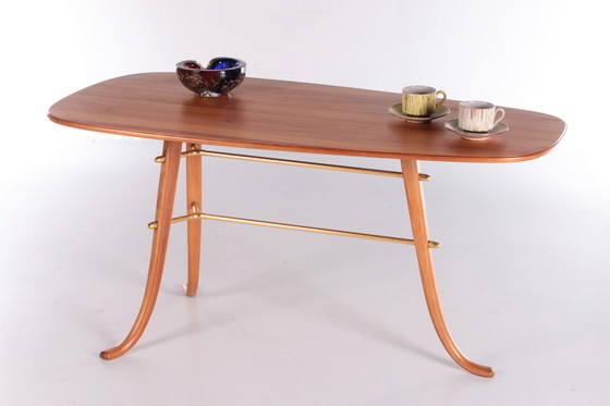 Image 1 of Vintage Salontafel met 3 poten en messing details Scandinavie.