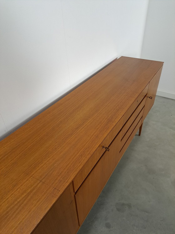 Image 1 of Lang Teak Dressoir Met Lades En Klepkast