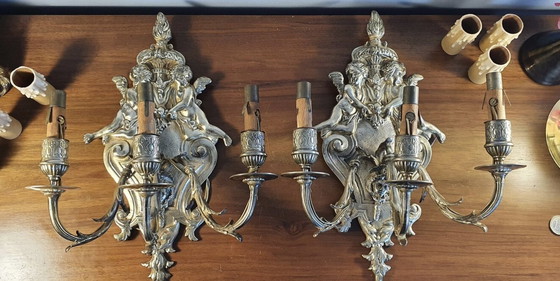 Image 1 of Duo D Appliques En Bronze Doré Louis Xiv À Décors D'Angelots Et Faune . Gemaakt in Frankrijk 19e eeuw.