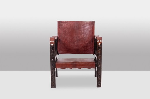 Safari" fauteuil in cognac hout en leer, jaren 1960/70.