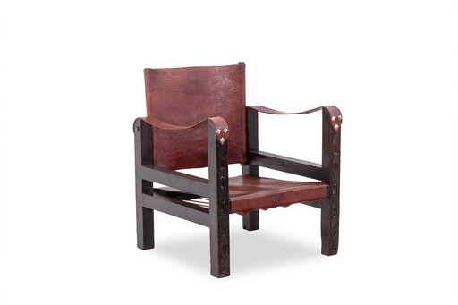 Safari" fauteuil in cognac hout en leer, jaren 1960/70.