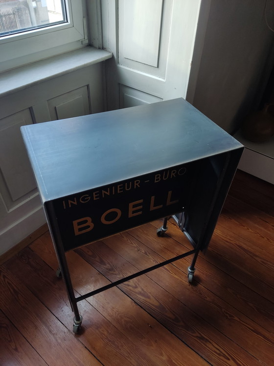 Image 1 of Console, bar trolley, modern industrieel, Boell, uniek stuk, ruw staal, oprolbaar, zwart-goud