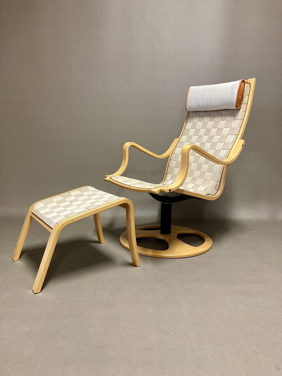 Image 1 of Scandinavische design draaifauteuil en voetenbank.