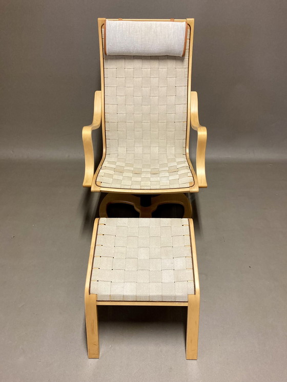 Image 1 of Scandinavische design draaifauteuil en voetenbank.