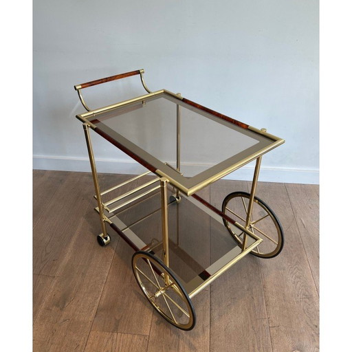 Vintage roltafel in messing en oranjerode celuloid