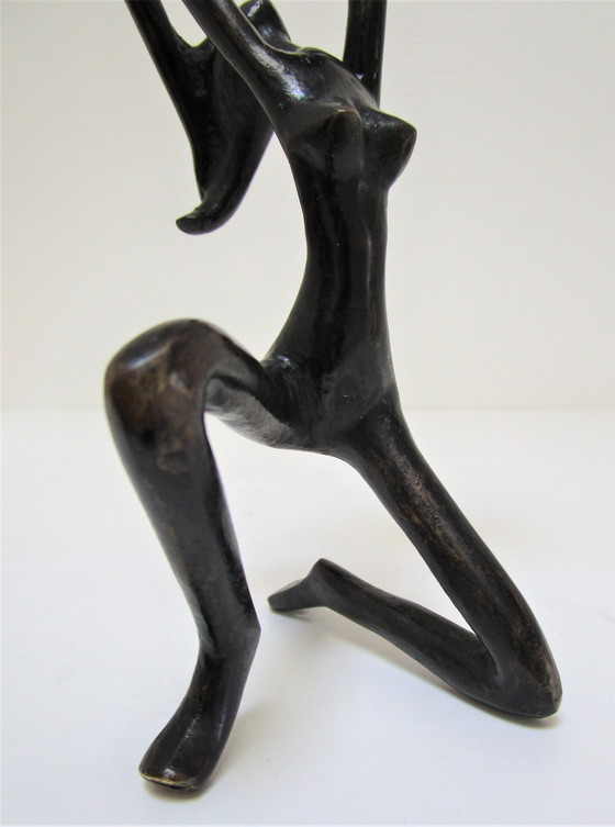 Image 1 of Gezwart bronzen kandelaar vrouw jaren 70