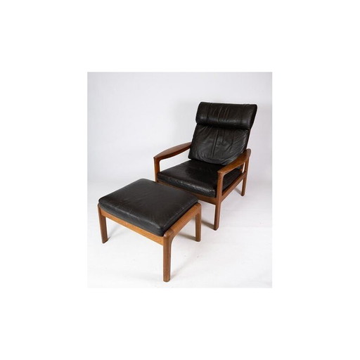 Vintage fauteuil met teakhouten kruk bekleed met zwart leer door Arne Vodder voor Komfort, 1960