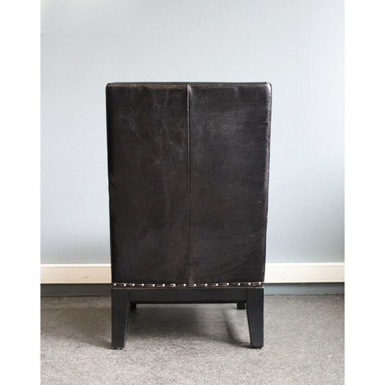 Image 1 of Zwart leren eetkamerstoel versierd met studs