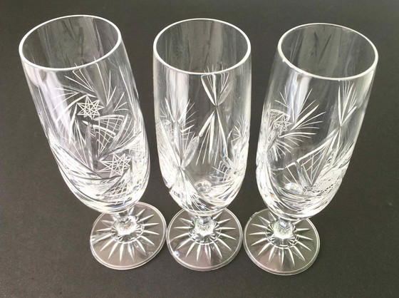 Image 1 of Set van 7 geslepen kristallen champagneflessen