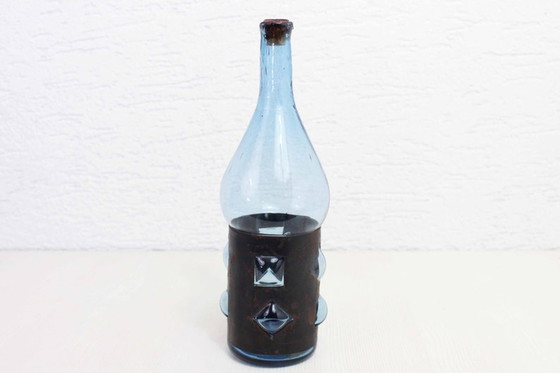 Image 1 of Geblazen glazen en metalen fles door Felipe Derflingher. 1960