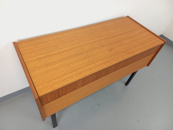 Image 1 of 70s Zwart Teak en metalen opbergkist op poten