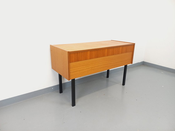 Image 1 of 70s Zwart Teak en metalen opbergkist op poten