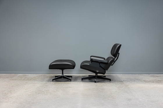 Image 1 of Eames lounge stoel+ voetenbank