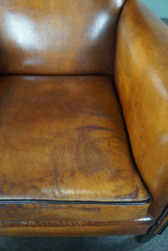 Image 1 of Art Deco fauteuil met zwarte biezen en siernagels