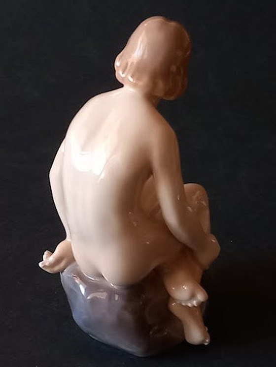 Image 1 of Royal Copenhagen 'Meisje op steen' van Ada Bonfils