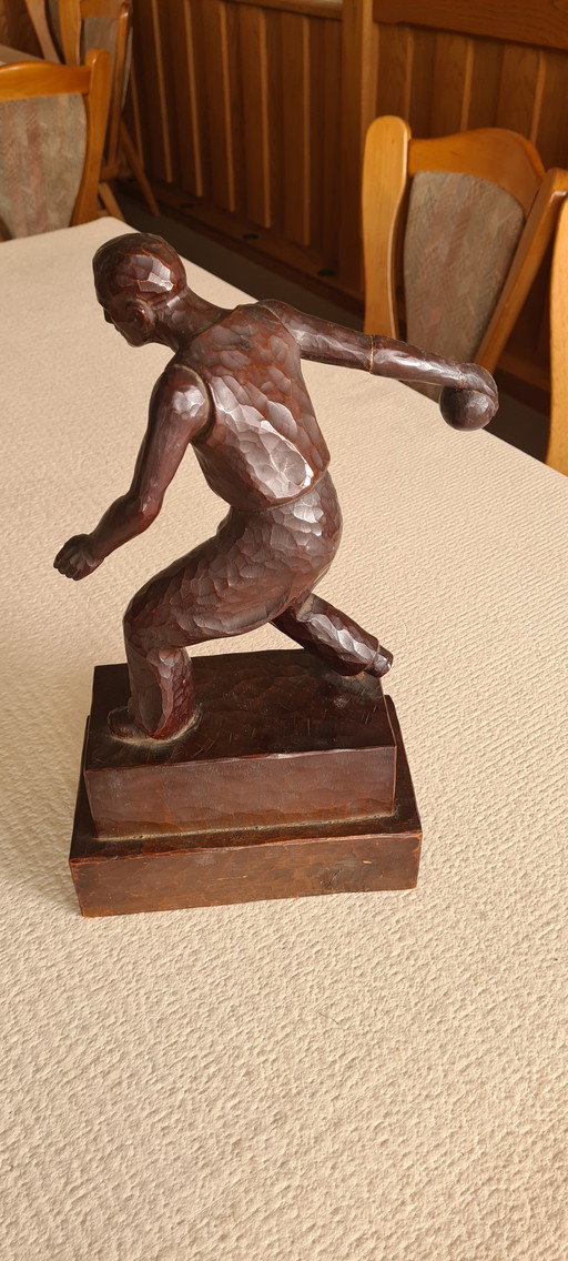 Handgemaakte houten figuur bowler