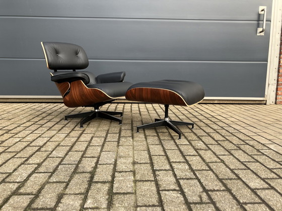 Image 1 of Herman Miller Eames lounge chair + Ottoman Santos Palissander Nieuwstaat!!