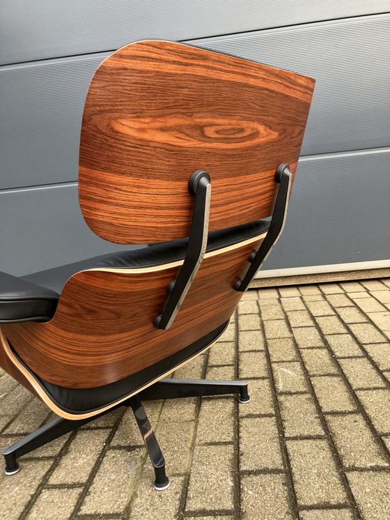 Image 1 of Herman Miller Eames lounge chair + Ottoman Santos Palissander Nieuwstaat!!