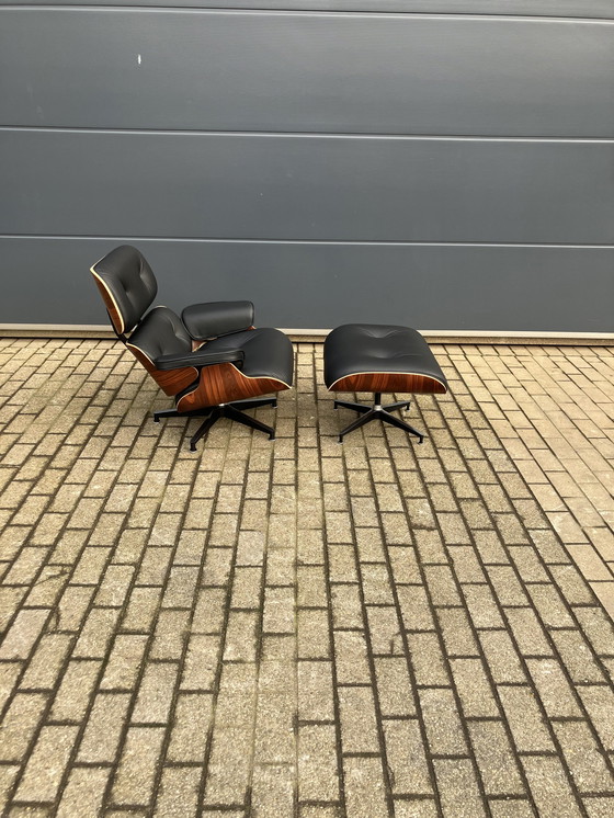 Image 1 of Herman Miller Eames lounge chair + Ottoman Santos Palissander Nieuwstaat!!