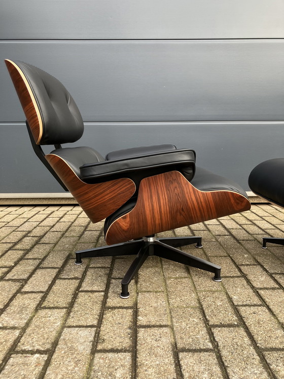 Image 1 of Herman Miller Eames lounge chair + Ottoman Santos Palissander Nieuwstaat!!