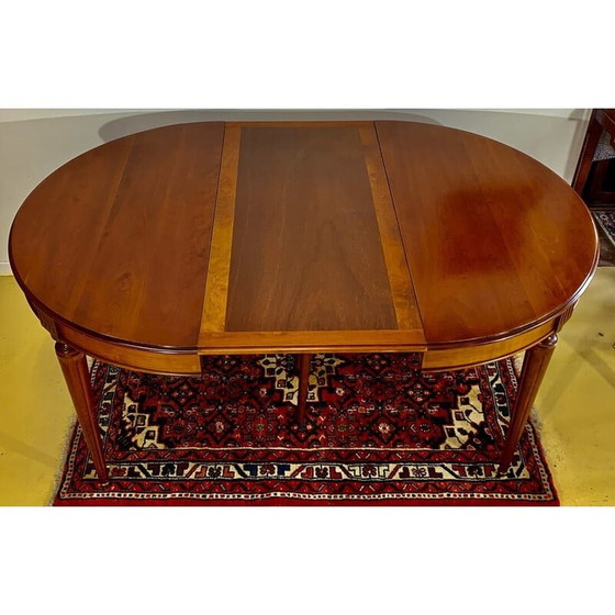 Image 1 of Vintage ronde tafel in kersenhout met 2 verlengstukken