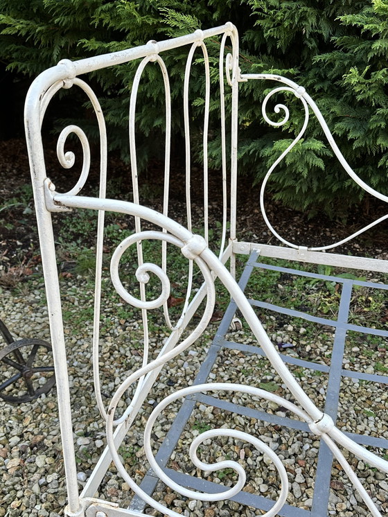 Image 1 of Antiek opklapbaar smeedijzeren bed uit 1880