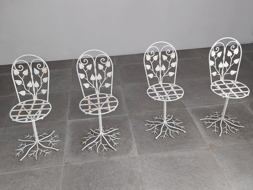 5X sculpturale smeedijzeren tuinstoelen