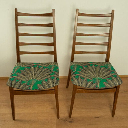 2x 1960 Teakhouten stoelen van Welzel: Groene hoes met palmboompatroon