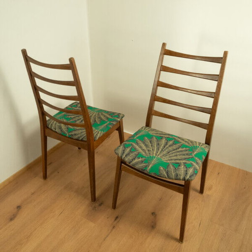 2x 1960 Teakhouten stoelen van Welzel: Groene hoes met palmboompatroon