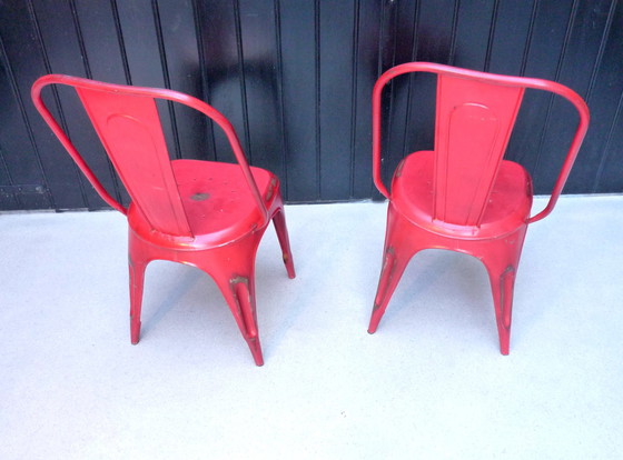 Image 1 of 2x Vintage stapelstoelen in rood plaatstaal