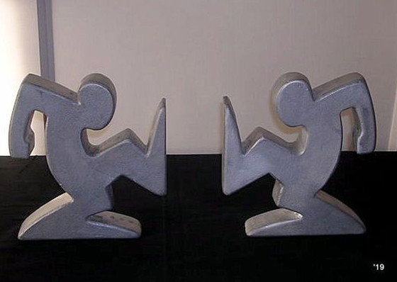 Image 1 of Set Zware Metalen Keith Haring  La Linea  Osvaldo Cavandoli Boekensteunen Zilverkleurig