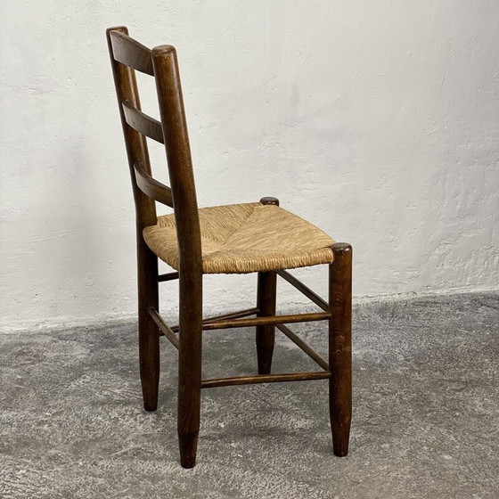 Image 1 of Vintage Bauche N°19 stoel in massief hout en stro van Charlotte Perriand