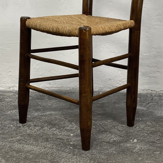 Image 1 of Vintage Bauche N°19 stoel in massief hout en stro van Charlotte Perriand