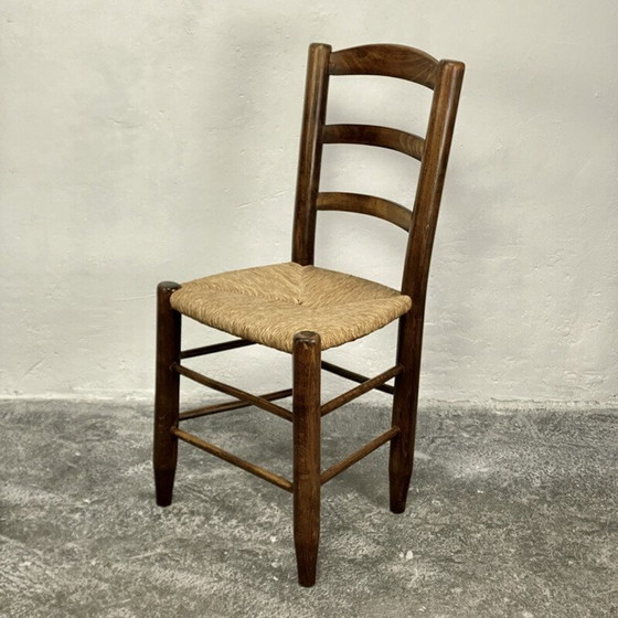 Image 1 of Vintage Bauche N°19 stoel in massief hout en stro van Charlotte Perriand