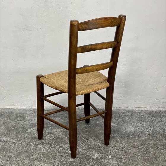 Image 1 of Vintage Bauche N°19 stoel in massief hout en stro van Charlotte Perriand