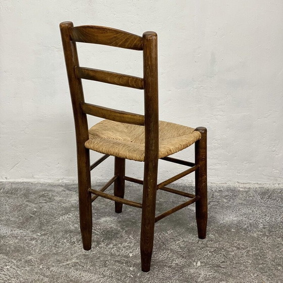 Image 1 of Vintage Bauche N°19 stoel in massief hout en stro van Charlotte Perriand