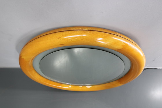 Image 1 of 1970S Italiaanse ronde spiegel in houten frame met licht